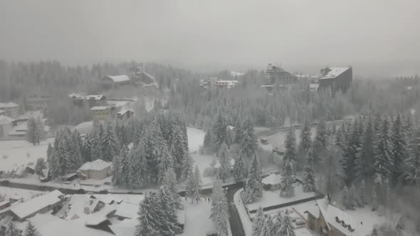 4k Drone Shot Over The Road Inside Small Village In Winter