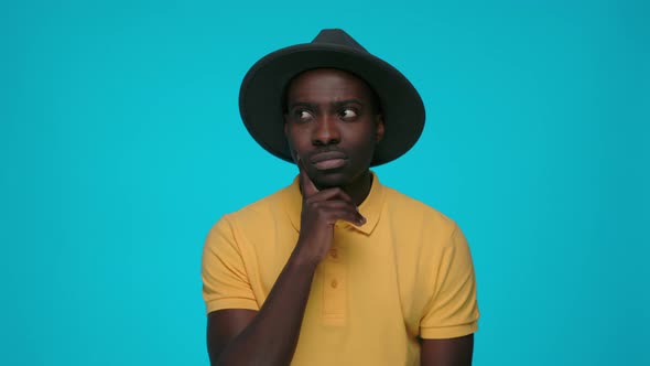 Pensive African Man Isolated Over Blue Background alt