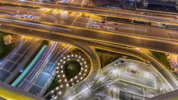 Aerial View of Highway Interchange in Dubai Downtown Night Timelapse alt