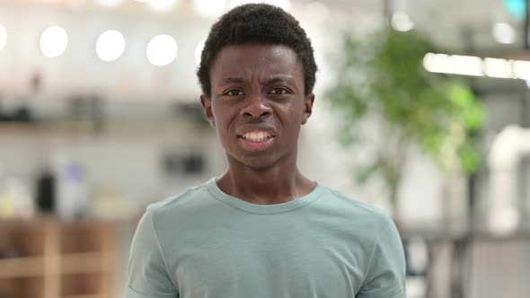 Furious Young African Man Screaming, Shouting alt