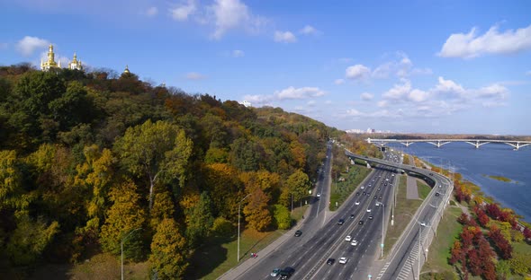 City Traffic in the City Near the River at the Autumn Aerial View