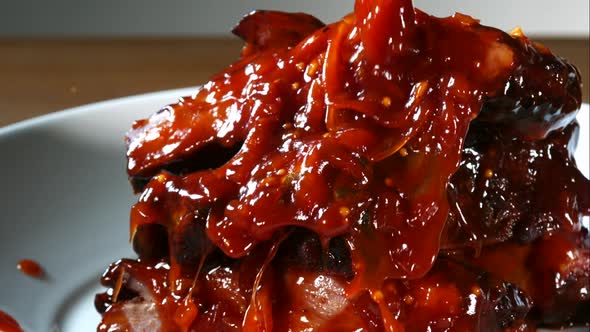 BBQ sauce pouring and splashing in ultra slow motion 1500fps onto BBQ ribs - BBQ PHANTOM 076 alt