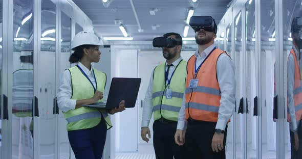 Electrical Workers in Reflective Vests Using VR alt