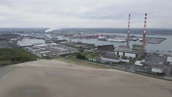 Poolbeg Generating Station (Poolbeg Stacks) At Dublin Port In Dublin, Ireland. aerial drone orbit alt