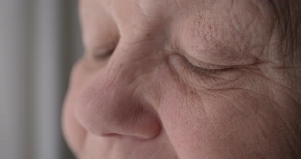 Sad eyes of an old woman. Close-up of the eyes of an elderly female