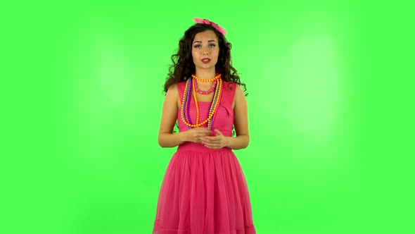 Beautiful Girl Is Reporting and Tells a Lot of Interesting Informations. Green Screen alt