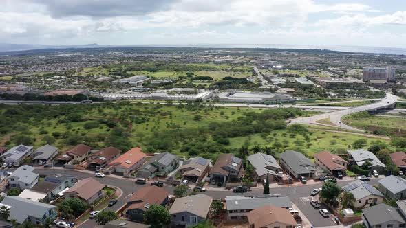 Wide panning aerial shot of the Kapolei suburbs in O'ahu, Hawaii. 4K alt