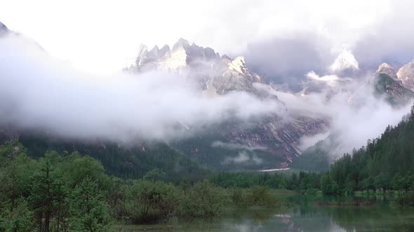 Mixture of Clouds with a Mist over a Mountain Lake
