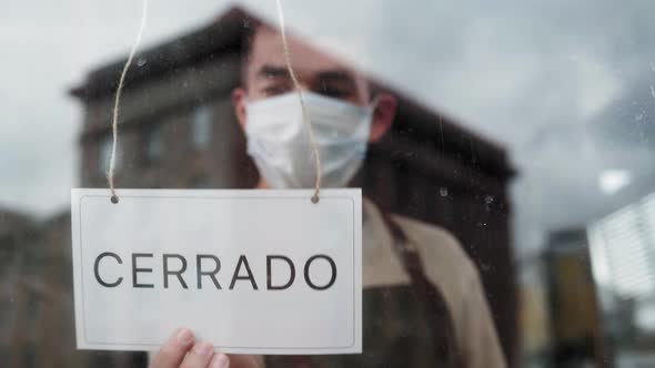 Waiter Turn Open Close Sign Entrance Door While Reopening Cafe During COVID19 Epidemic alt