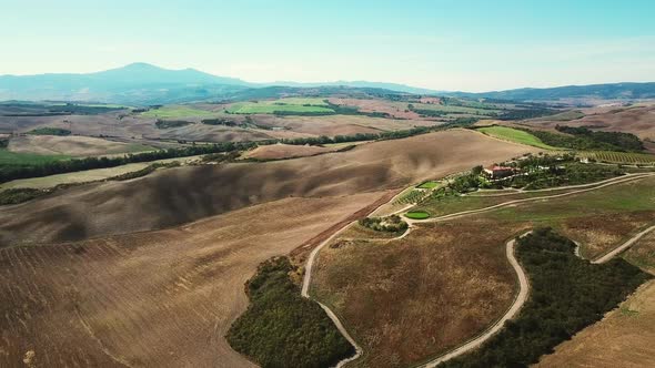 AERIAL View of fields in hilly landscape / Tuscany, Italy