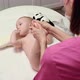 The masseuse gives a foot massage to baby (boy) 17 - VideoHive Item for Sale