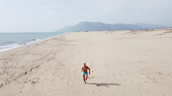 Man running on the sand