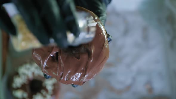 Desserts, Delicious Chocolate Donut Made By Hand in Bakery with Pastry Chef Sprinkled with Sweet alt
