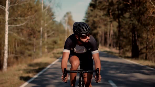 Cyclist Cycling On Road Bicycle.Professional Cyclist Triathlete Cycling On Triathlon Bike Workout. alt