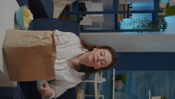 Vertical Video Young Woman Removing Face Mask After Getting Takeout Food alt