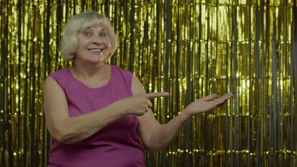 Senior Old Woman Pointing Empty Place on Her Palm, Copy Space Advertising Area on Hand alt