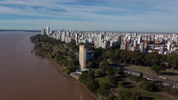 drone flight over the river parana with a view of the huge city of rosario with its high buildings i alt