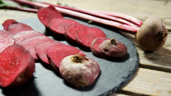 Sliced beetroot arranged on concrete board 4k alt