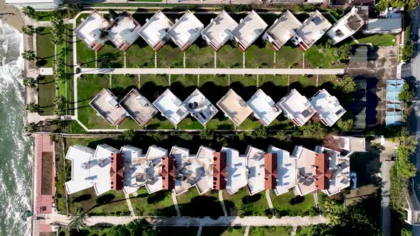 Complex of cottages on the beach alt