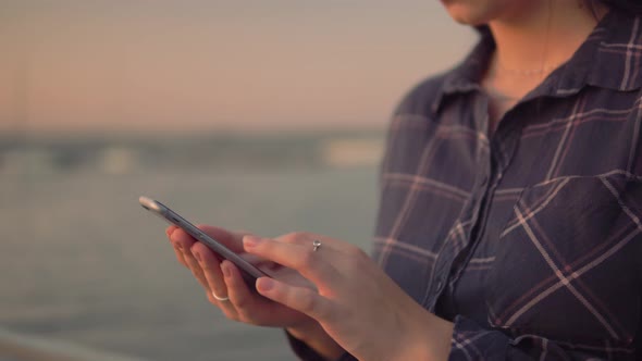 Woman Use Smartphone Swiping Screen and Typing Outdoor Hands Close Up Blogger