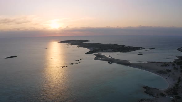 Elafonisi lagoon at Sunrise. Aerial view above sea. Flying over coast line alt