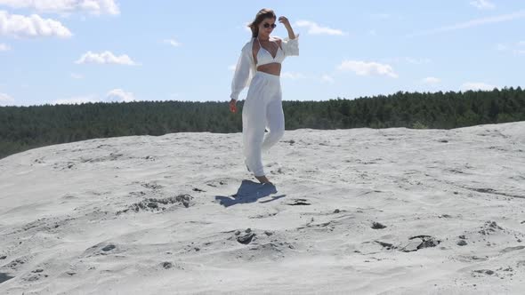 Beautiful Woman Walking on Shore