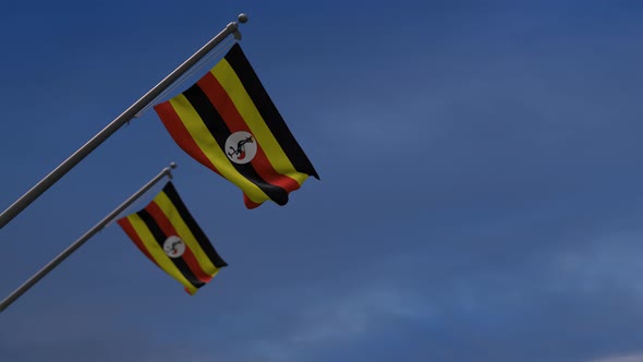 Uganda Flags In The Blue Sky - 4K