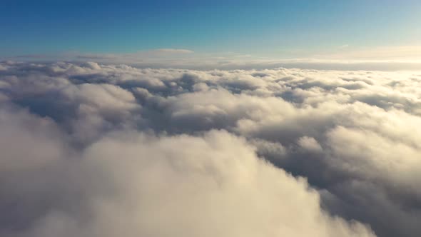 Flight through the moving cloudscape. Texture of clouds. Airplane view