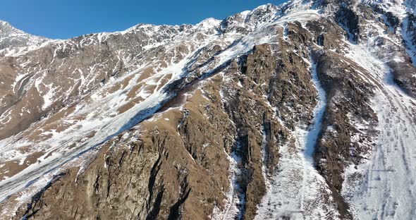 Aerial view of beautiful snowy mountains near Kazbegi, Georgia alt