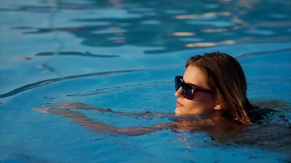 Gorgeous Woman Is Going for a Swim. alt