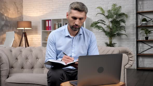 Businessman Listens Report Manager Online Laptop Business Meeting Makes Notes alt