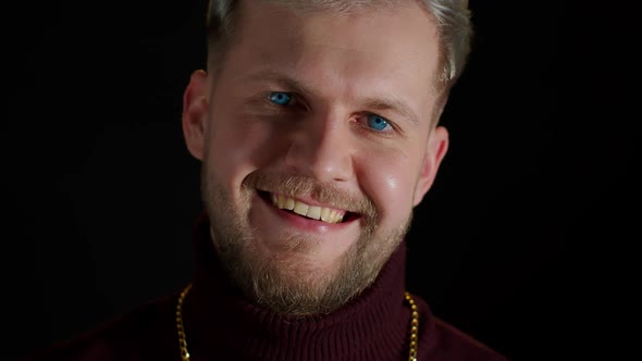 Stylish Young Man Looking at Camera Feeling Happiness Fun and Enjoyment Showing Smile Gesture alt