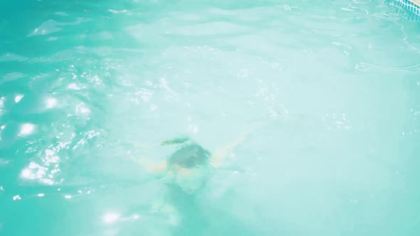 Little Funny Girl in the Outdoor Swimming Pool