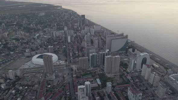 Aerial shot of Dinamo Batumi Stadium near Heroes Square against cityscape alt