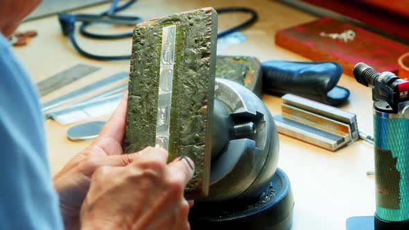 Craftswoman working in workshop alt