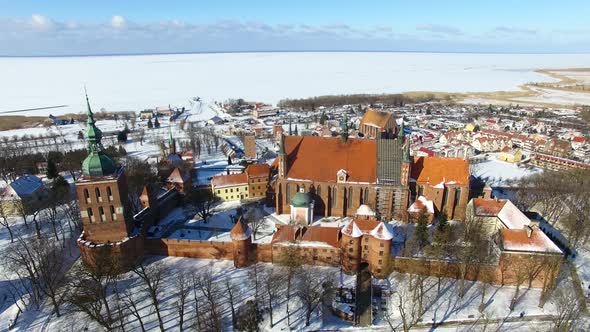 Aerial: Castle of Frombork in Poland, wintertime alt