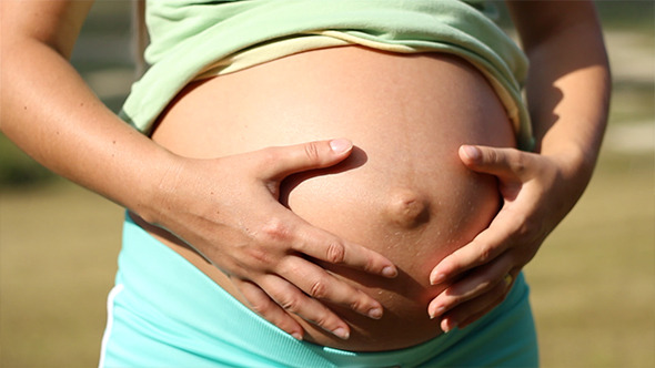 Pregnant Woman Proud of Her Belly alt