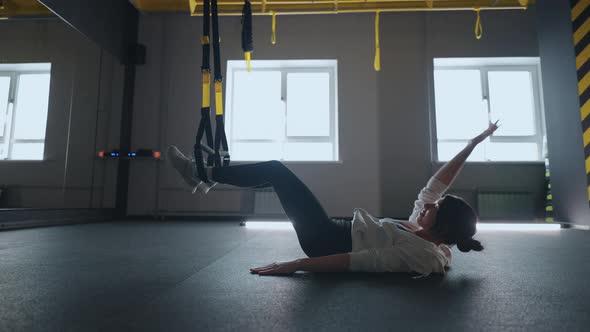 Crossfit Fitness TRX Training Exercises at Gym Woman Pushup Workout alt