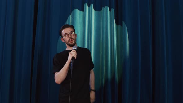Standup Comedian on Stage Says Goodbye to the Audience and Leaves