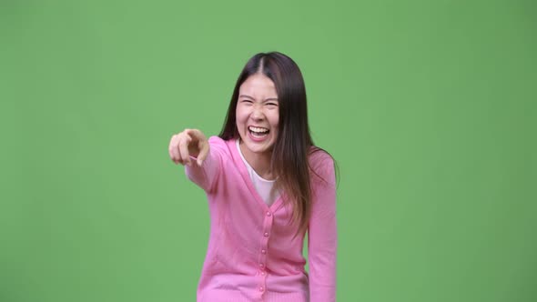 Young Beautiful Asian Woman Laughing