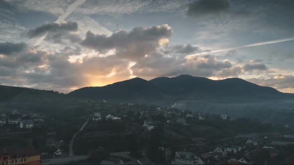 Wonderful Mountain Village in Darkness Against Rising Sun alt