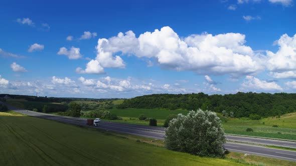 Traffic on the Intercity Highway Between the Natural Parkland Aerial View alt