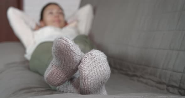 Woman get warm with socks.  alt