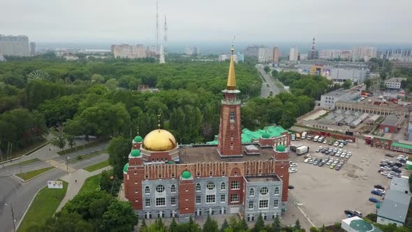 Large Mosque with Minaret in Modern Urban Landscape, Aerial View