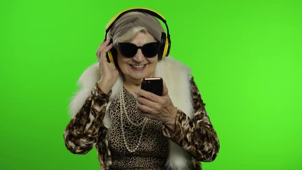 Elderly Grandmother. Caucasian Woman. Dance, Celebrate, Listen Music. Chroma Key alt