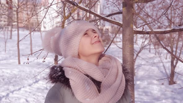 Teen By Snow Covered Fir Tree alt