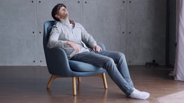 Happy Man Relaxing on Comfortable Armchair, Smiling Calm Relaxed Guy Lounge Eyes Closed in Sunny alt