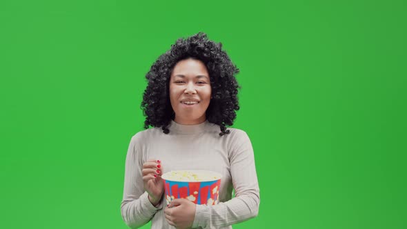 Green Screen Young Cheerful African Female Eats Snack