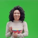 Green Screen Young Cheerful African Female Eats Snack - VideoHive Item for Sale