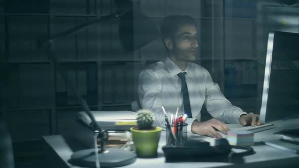 Businessman working in the office at night